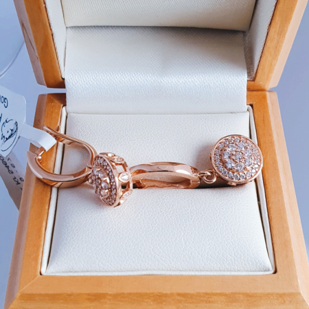 Golden earrings with white zirconia stones