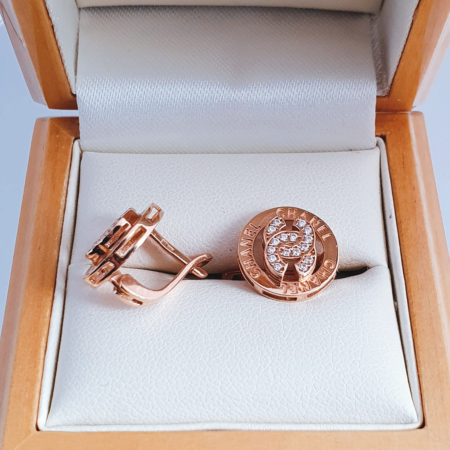 Earrings with chanel sign and white zirconia